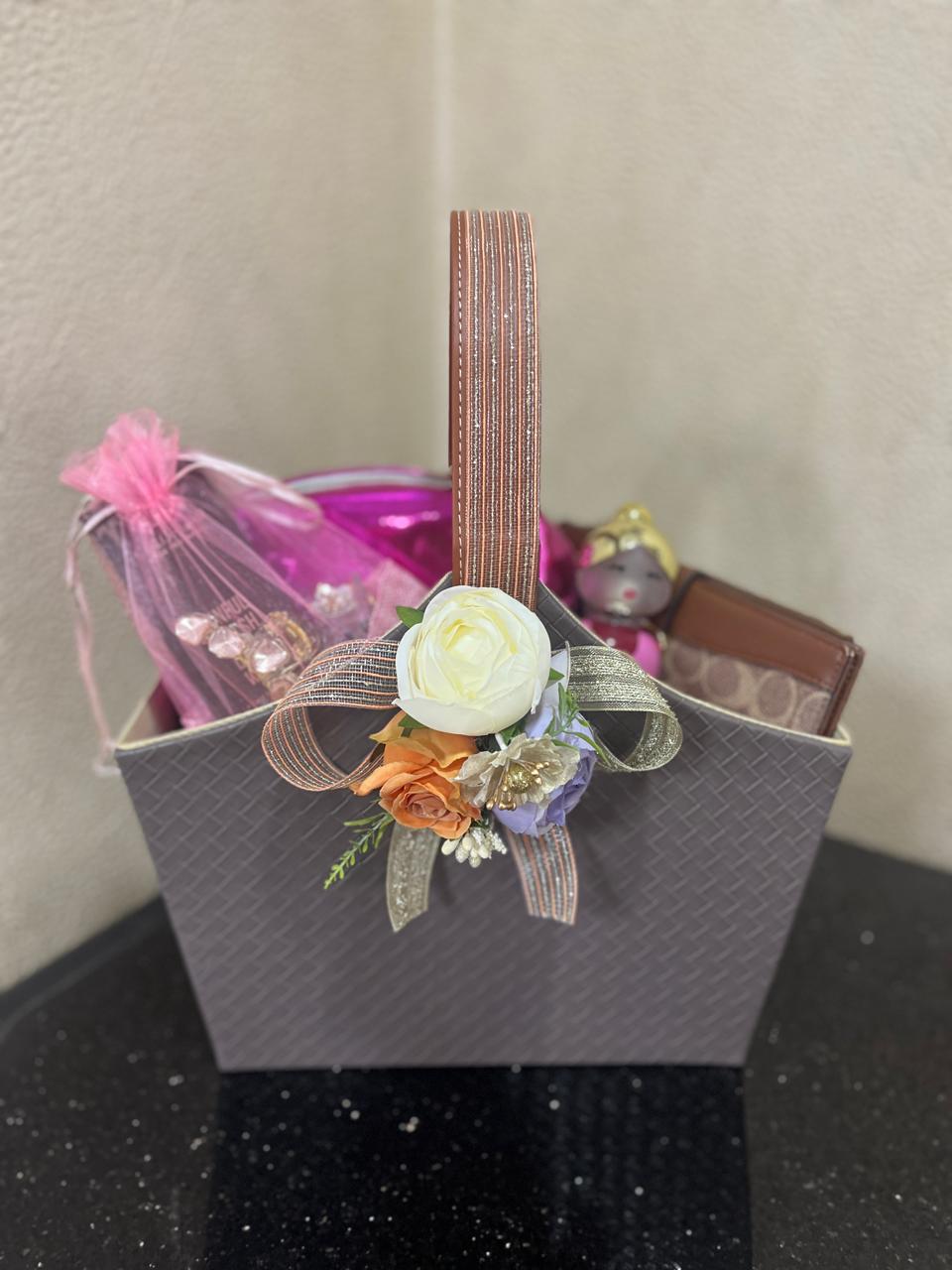 Gift basket with elegant ribbon and floral decorations